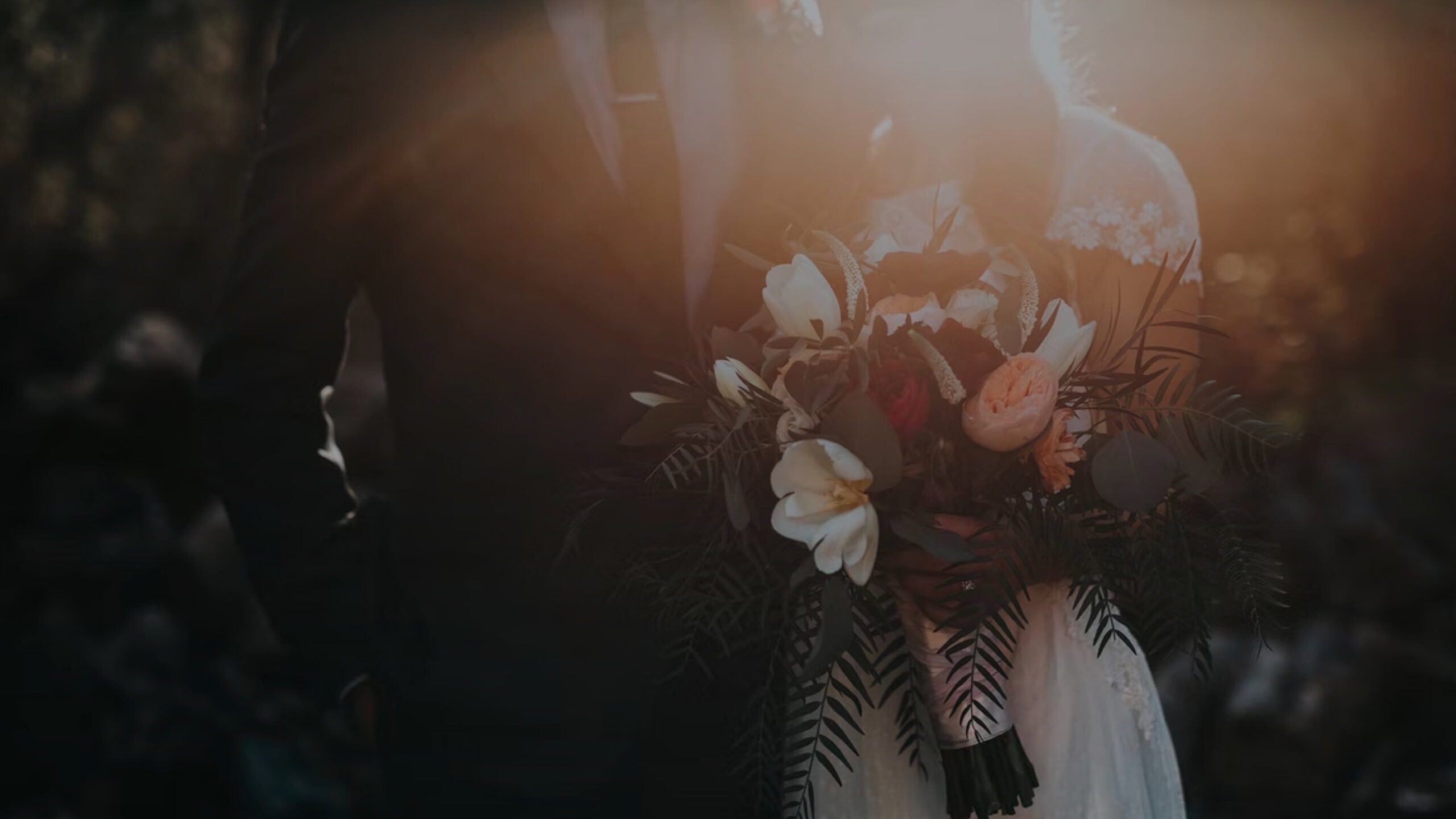 Bride and groom holding a wedding bouquet