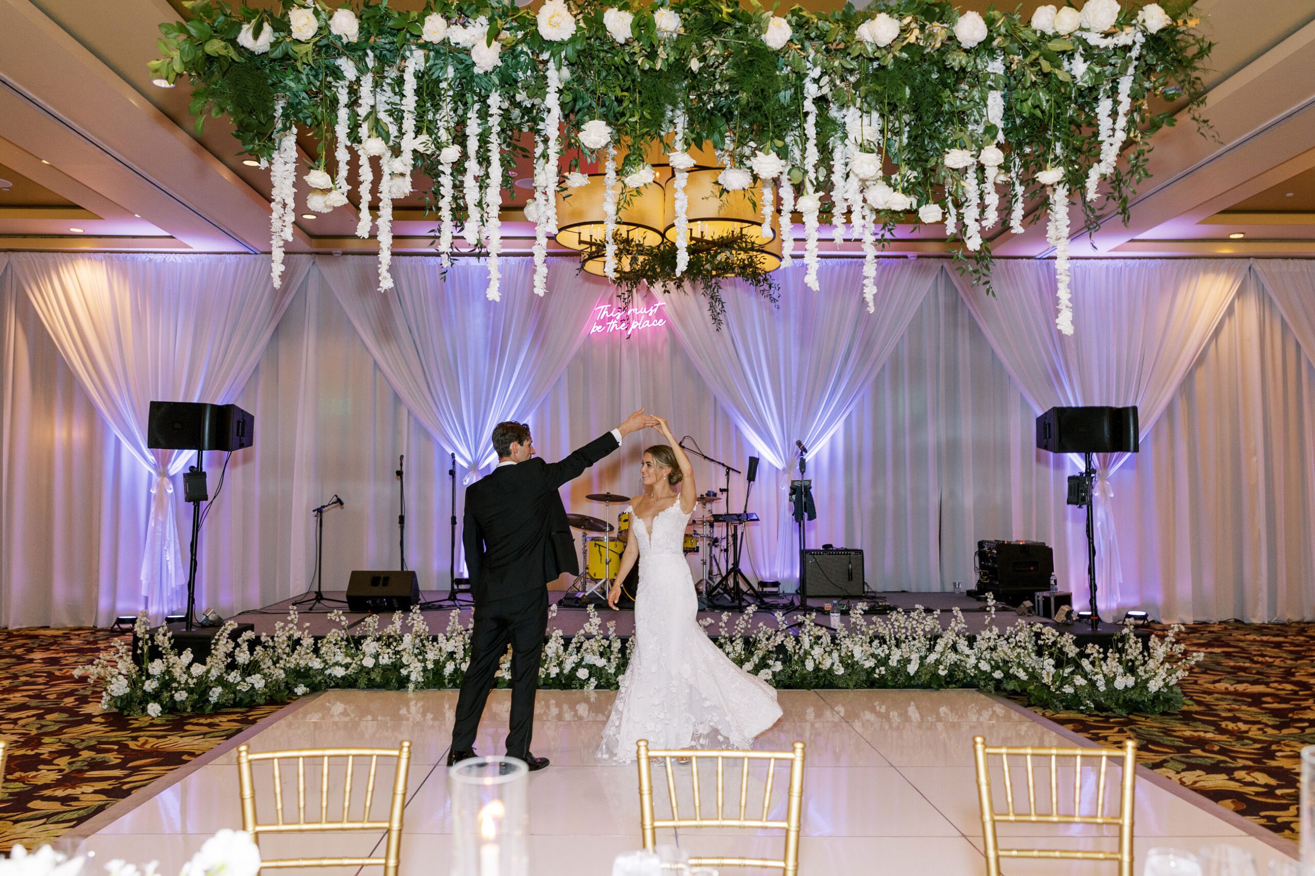 groom bride dance at wedding reception stage